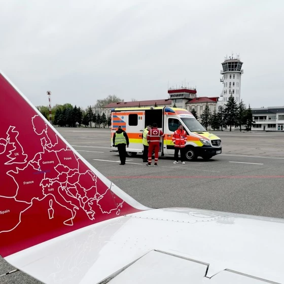 Luxembourg Air Rescue team welcoming a Ukrainian family upon arrival of an air ambulance jet on the tarmac at Findel during a humanitarian mission.