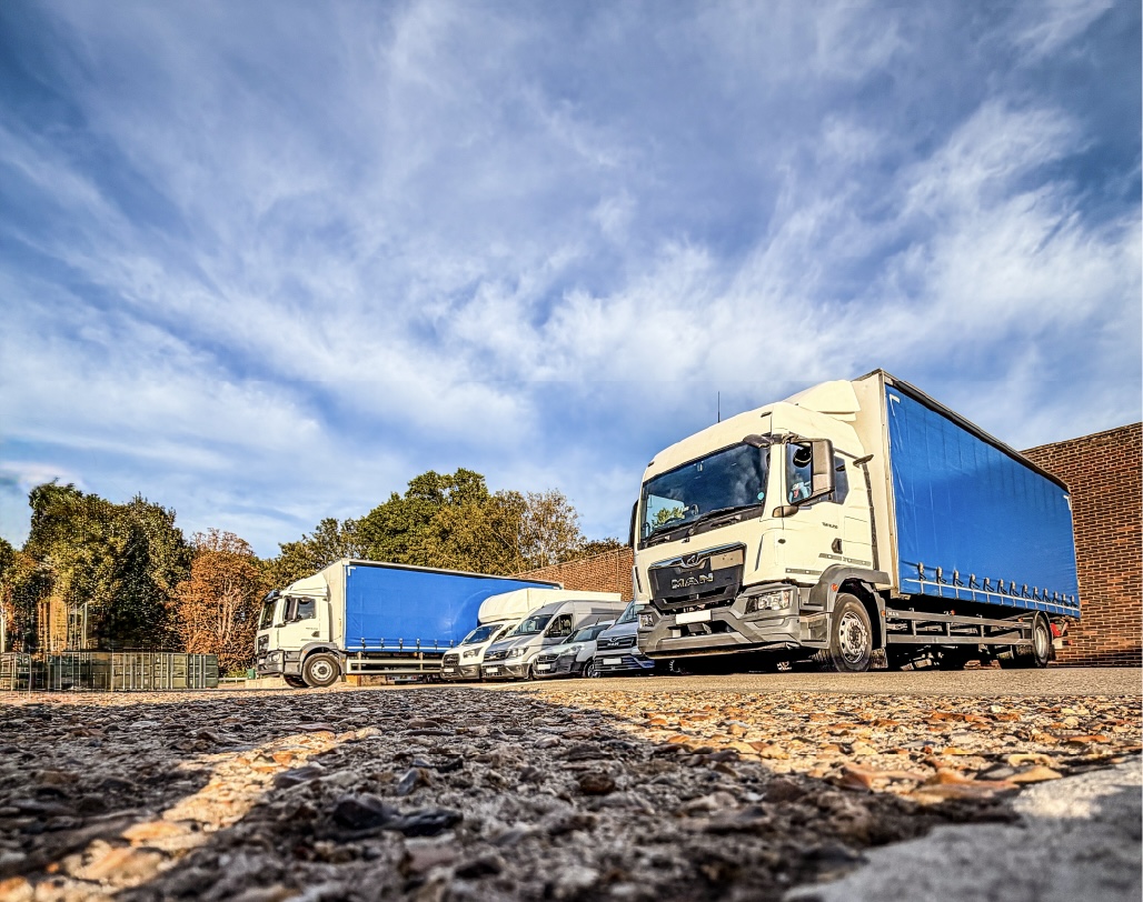 MAC Courier Service delivery vehicles parked outside the storage facility.