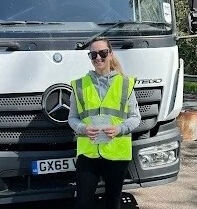 Learn2Pass HGV student in hi-vis jacket beside training vehicle during course in Medway.