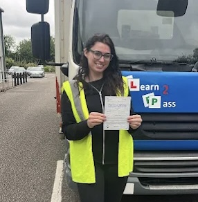 Learn2Pass HGV trainee celebrating pass with certificate at our Gillingham training centre, Kent.