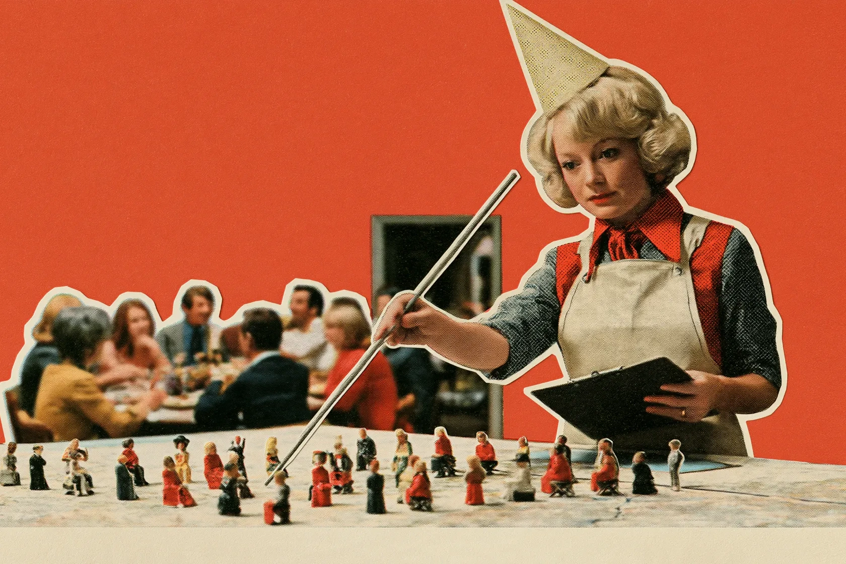 A hostess in a party hat and apron points a long stick at tiny figures arranged on a map, a clipboard in hand, while a full table of diners talks behind her.
