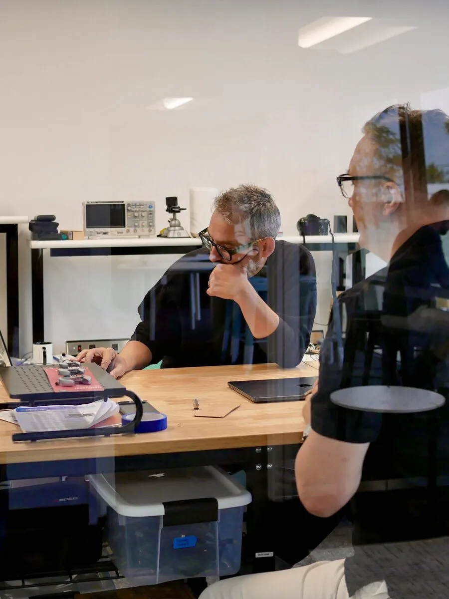 Archetype AI engineers working at their desks in the office