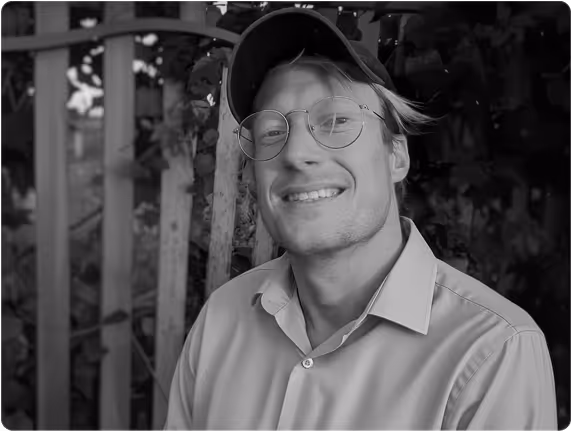 a man wearing glasses and a hat