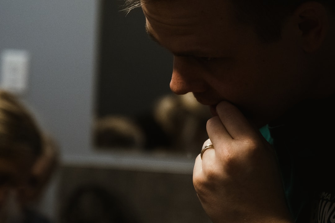 a person holding the chin