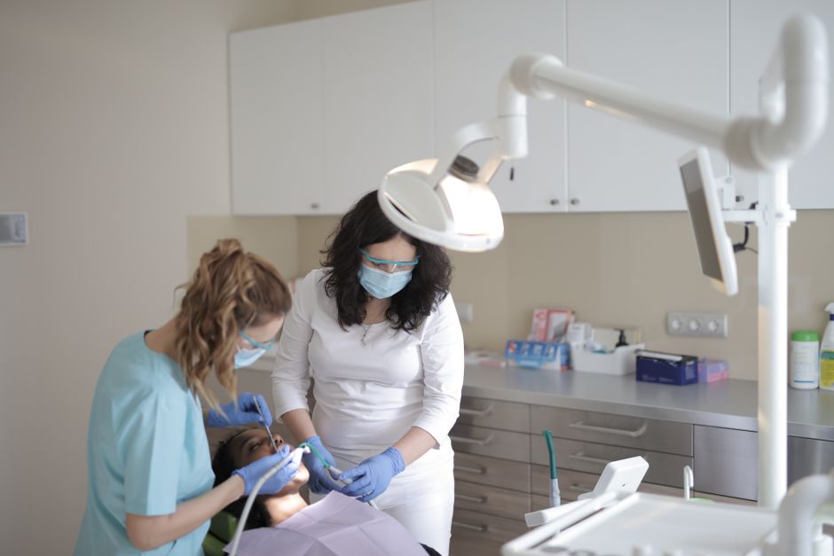 Patient holding jaw in pain, illustrating when emergency dental care is needed for a dental emergency.