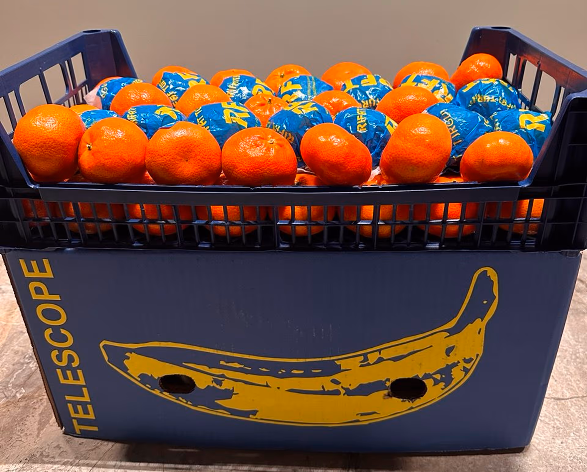 Box with mandarins.Brand Telescope