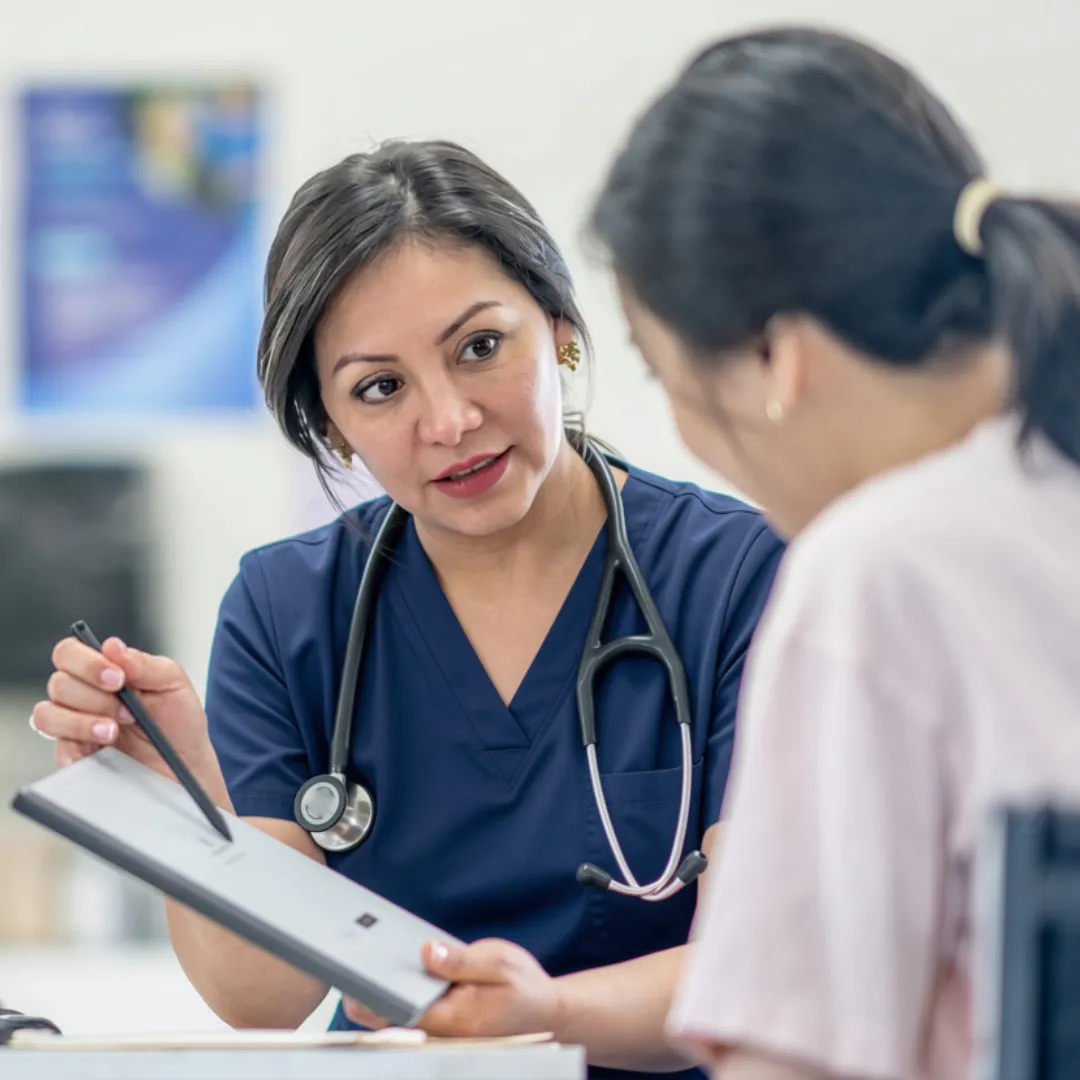 GP talking through results with a patient during a private consultation