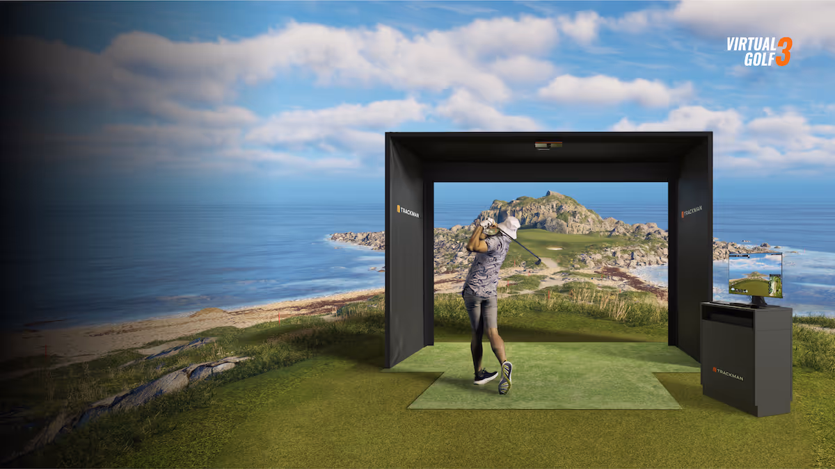 Trackman simulator of a golfer swinging his club and hitting the ball.