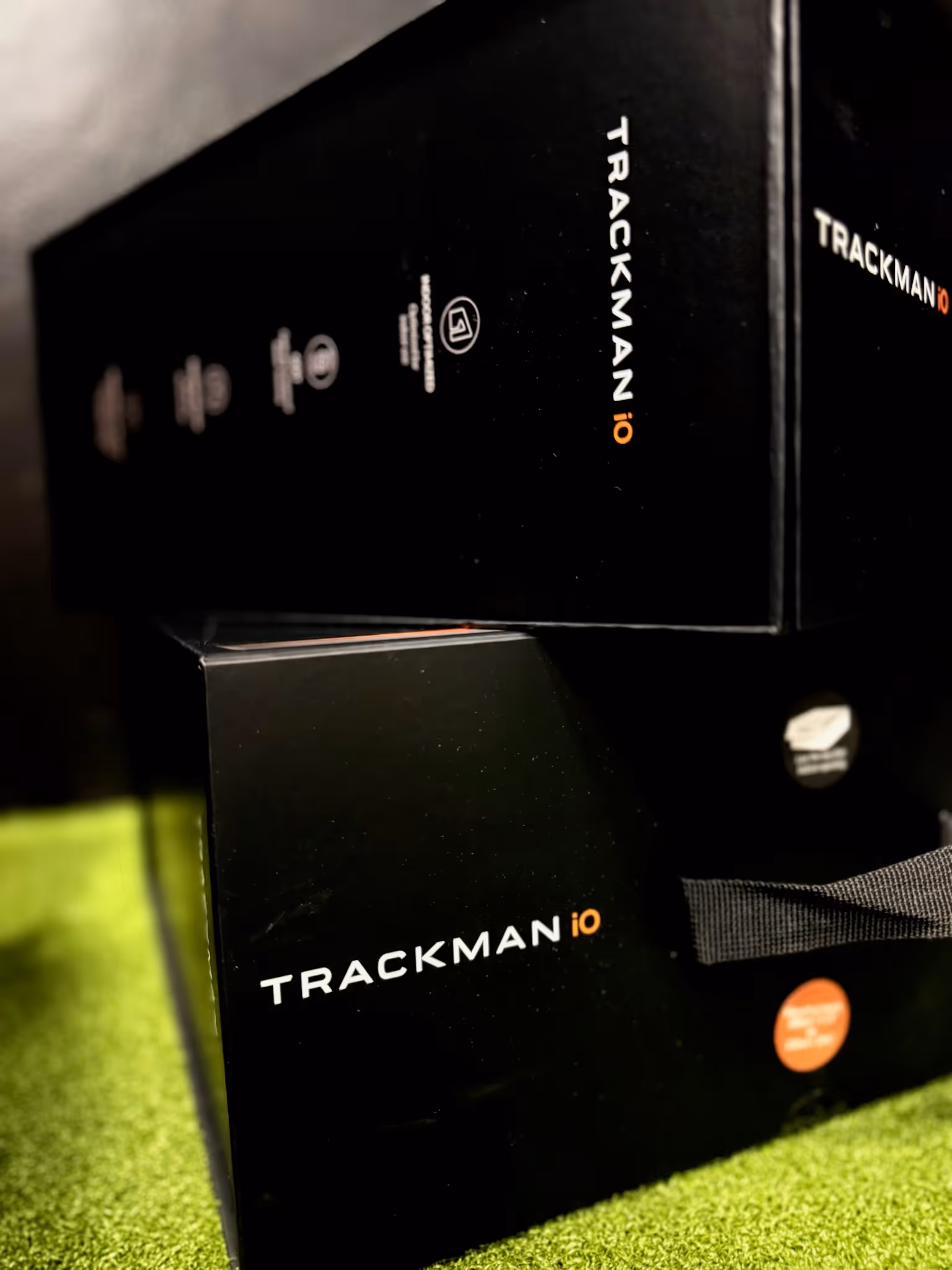 Trackman boxes on indoor golf green