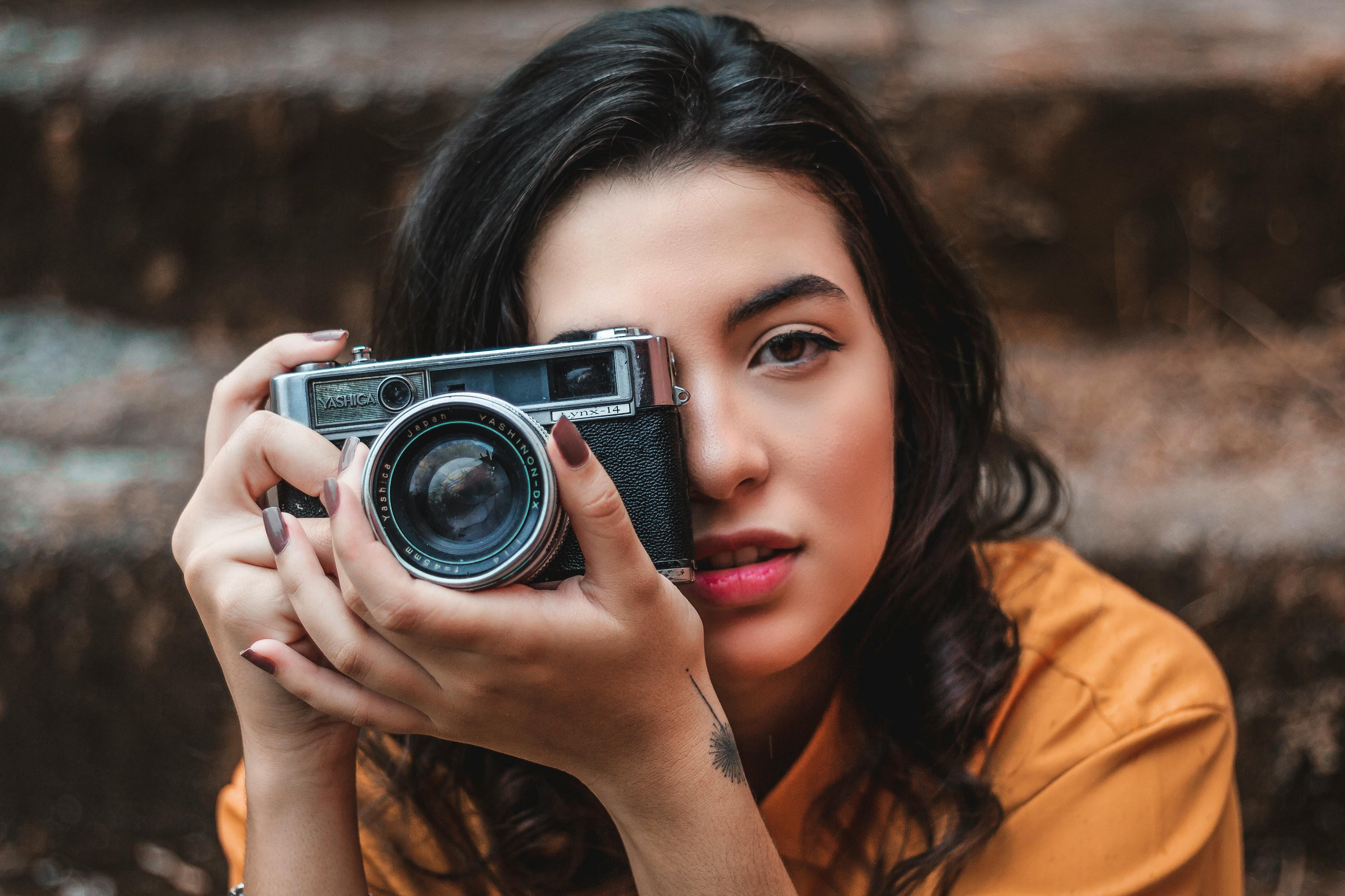 photographer holding the camera in front of her face