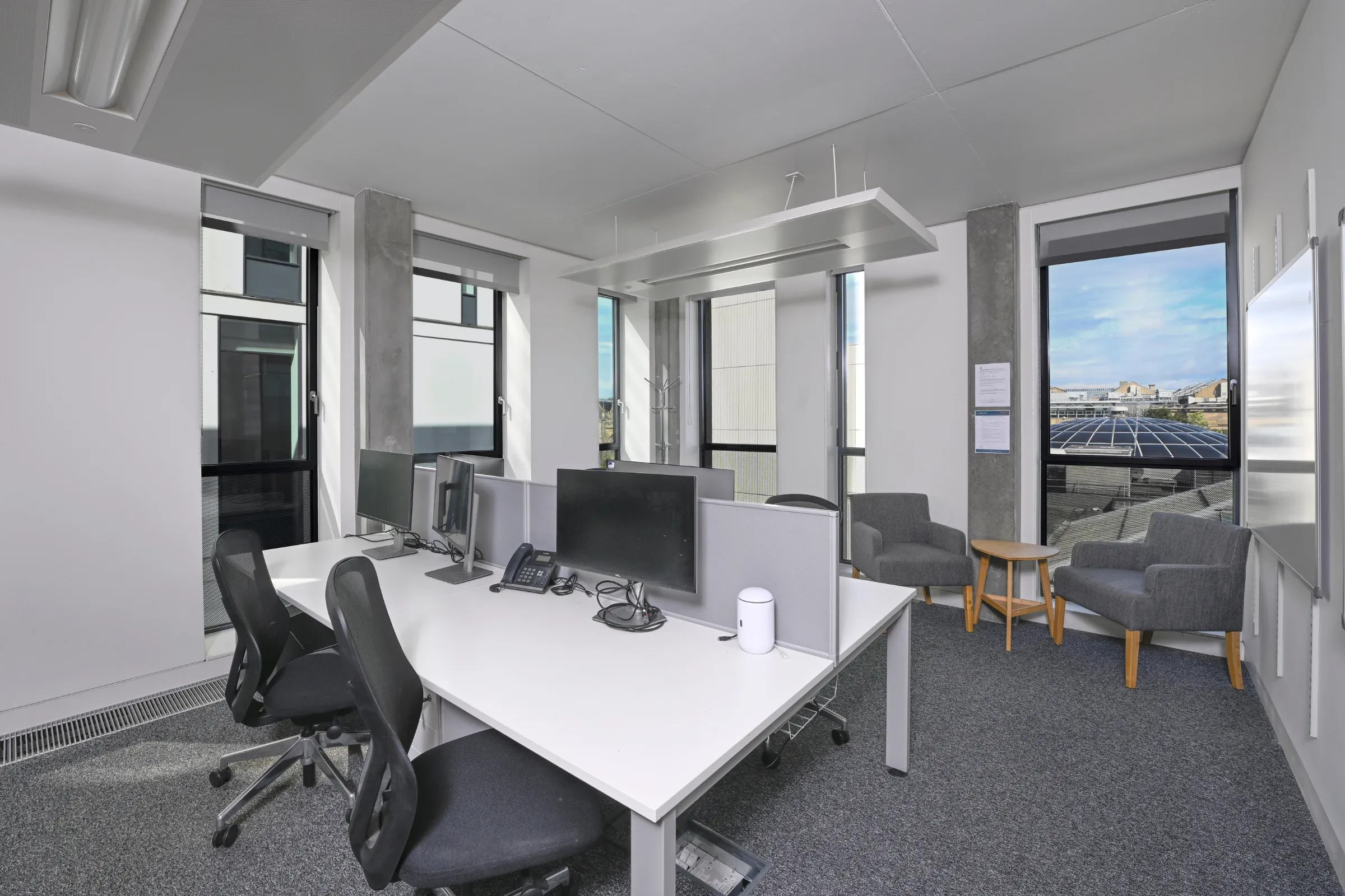 Interior view of Bayes Centre showing multi-level open workspace with modern offices, collaborative areas and meeting spaces