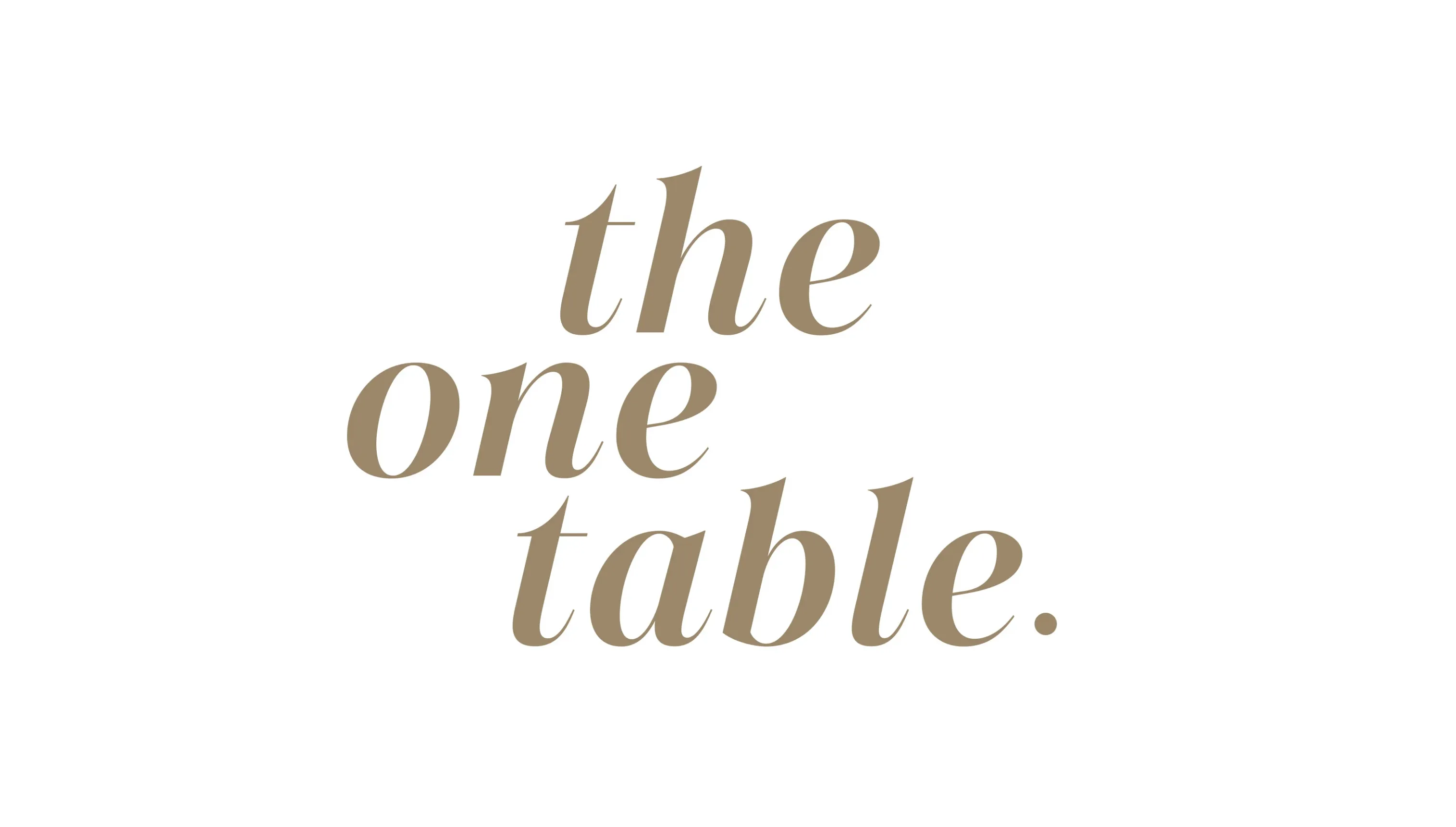 Text in brown serif font reading 'the one table.' on a white background.