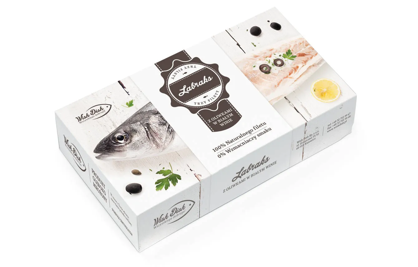 Package of Labrax sea bass fillets with olives in white wine, featuring image of a fish head, fillets garnished with olives and parsley, and a lemon slice on a white wooden surface.