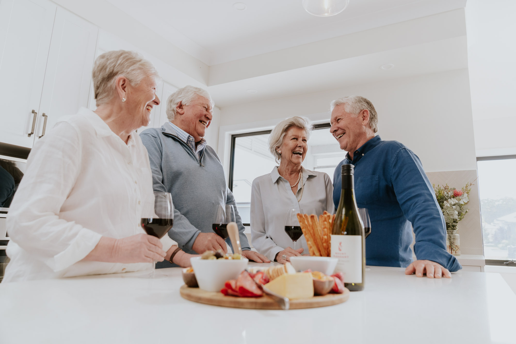 Older Friends enjoying a drink together