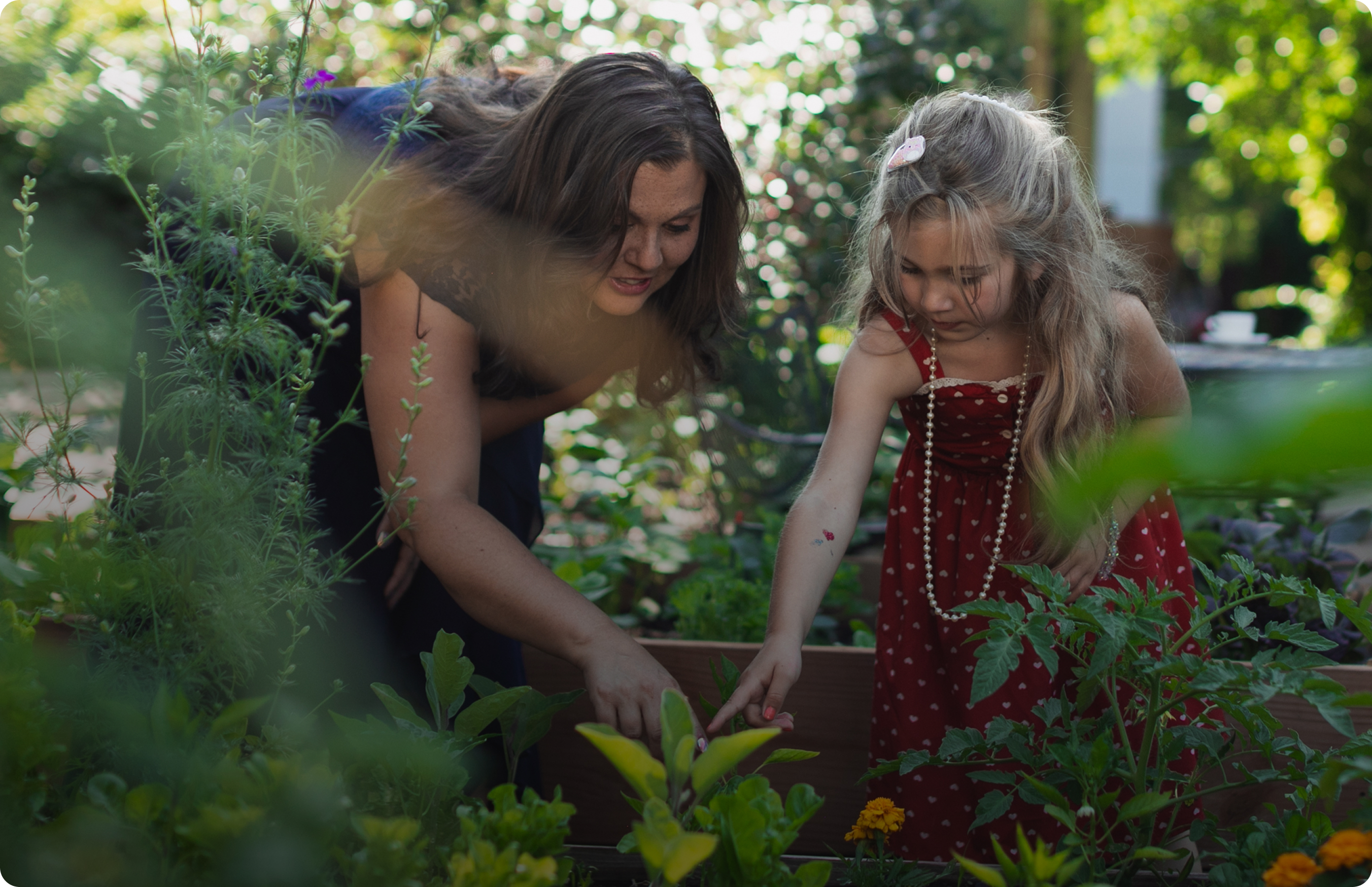 mom and daughter gardening 