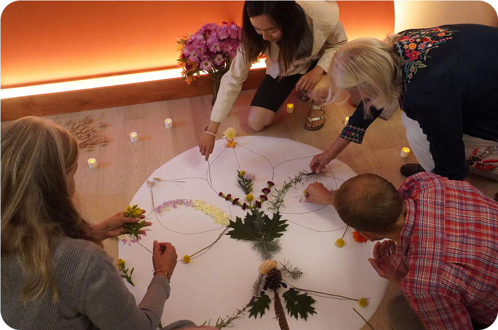 people doing arts and crafts with flowers