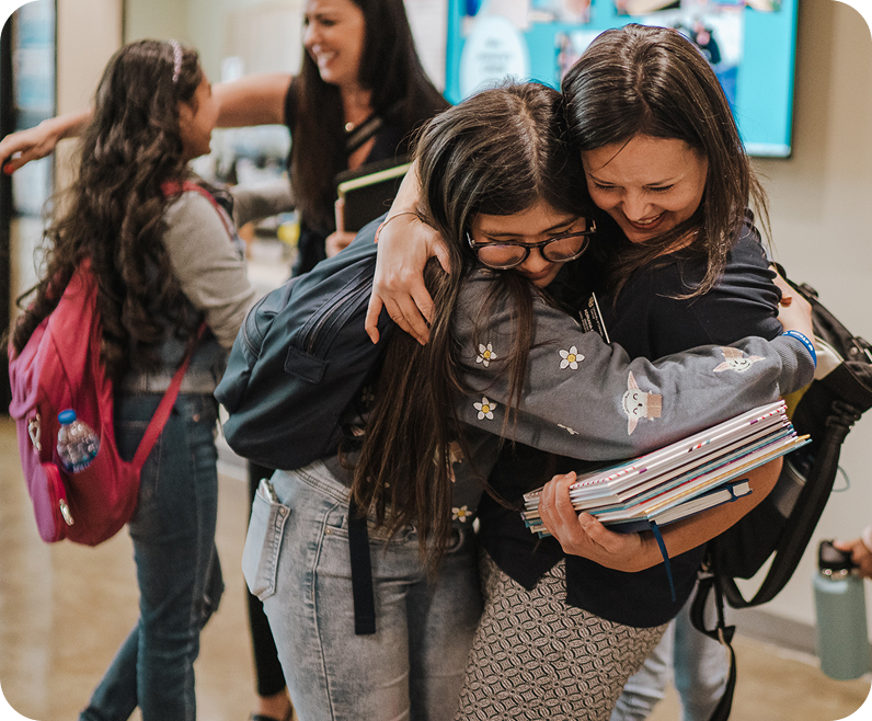 students hugging