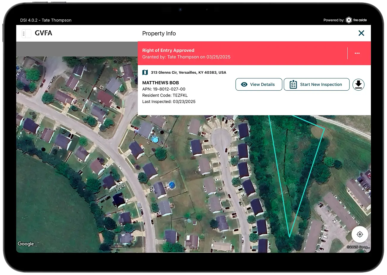 An aerial view of a neighborhood on a tablet.