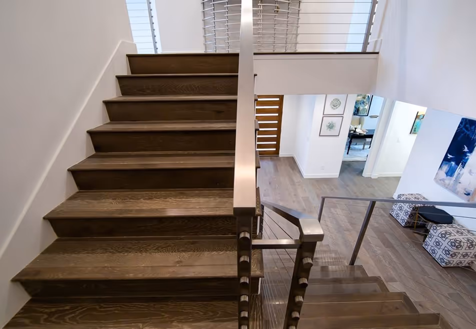 Looking down stairs to the entry way of the home.