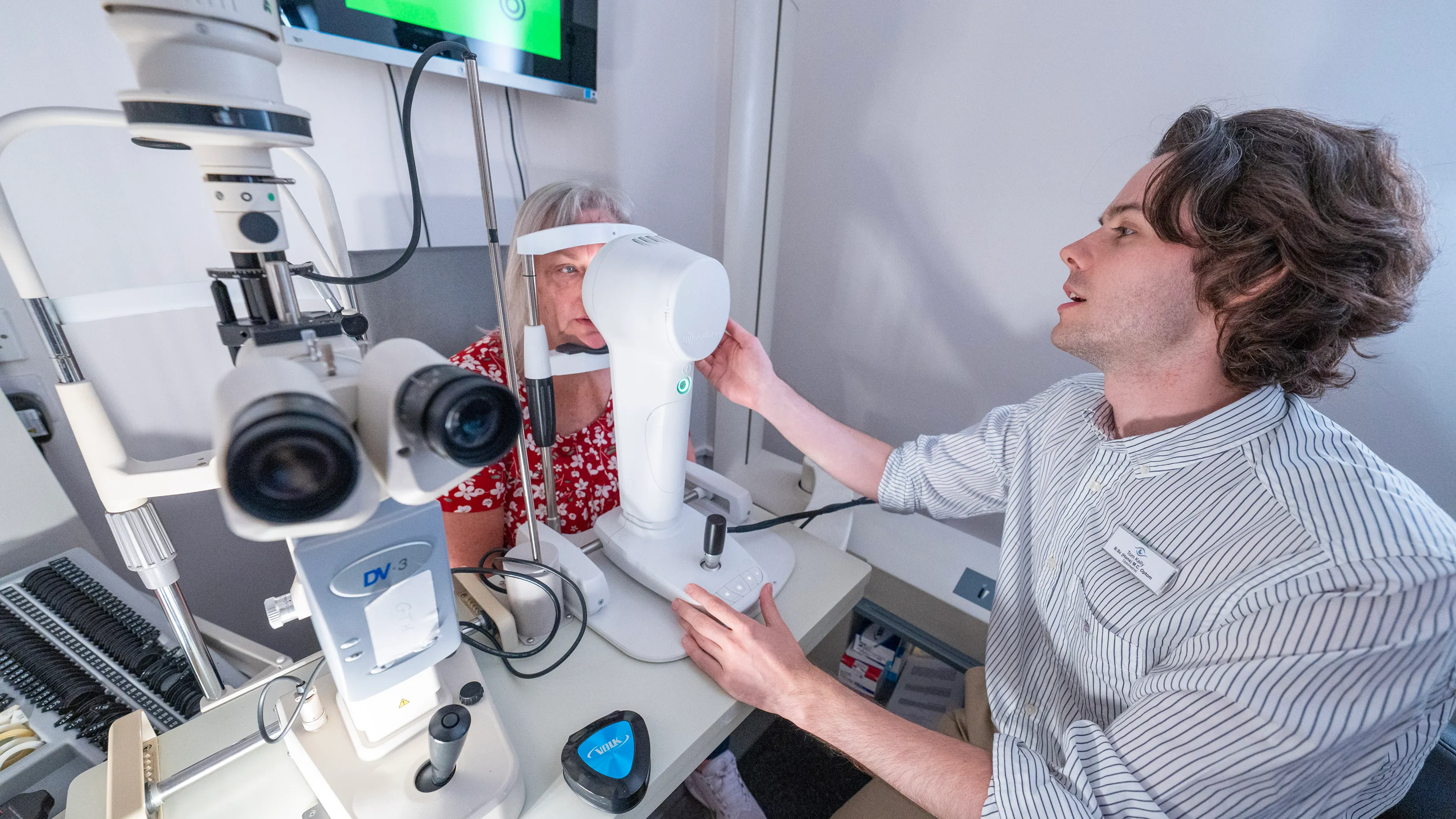 Eye examination with professional using advanced optical diagnostic equipment