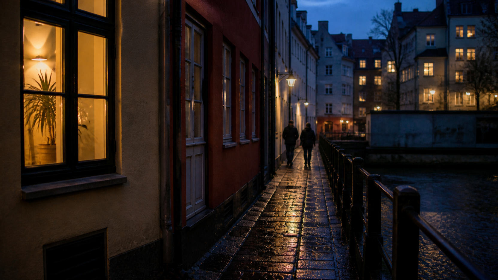 A wintry Copenhagen canal street at blue hour, wet cobblestones reflecting warm light from lit windows, two distant figures too far away to identify.