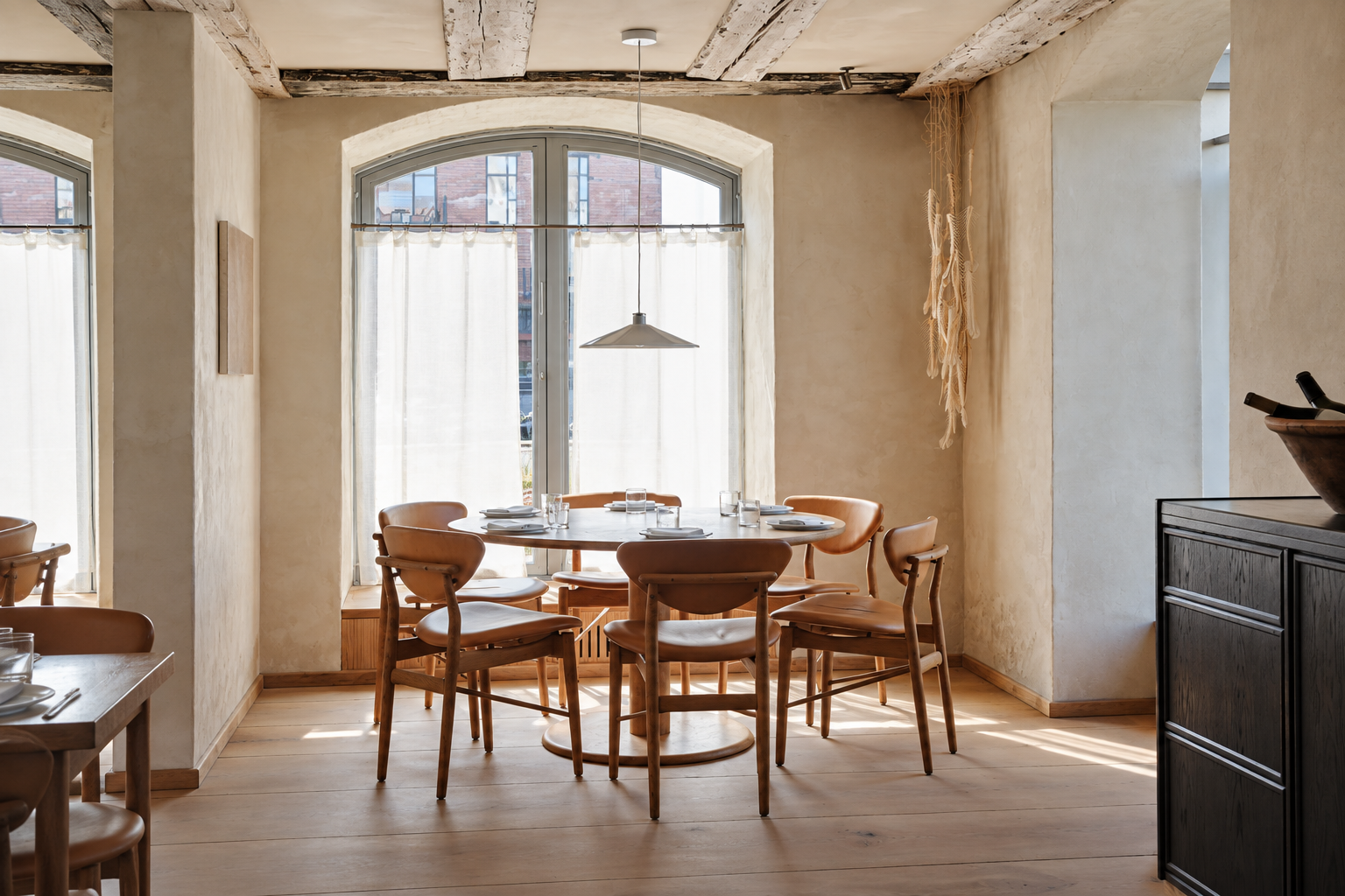 A quiet table in a cream-coloured Copenhagen restaurant room