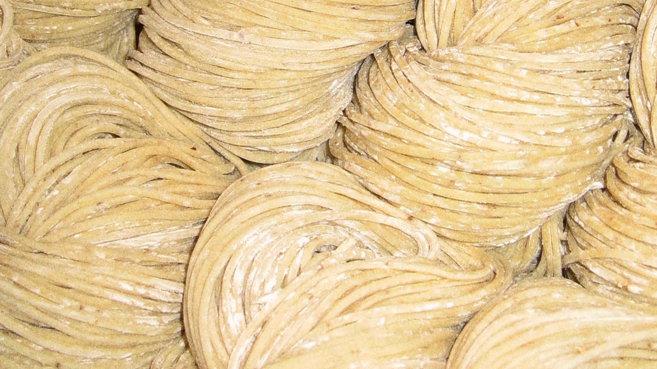 Closeup of fresh, flour-dusted noodle nests at Slurp
