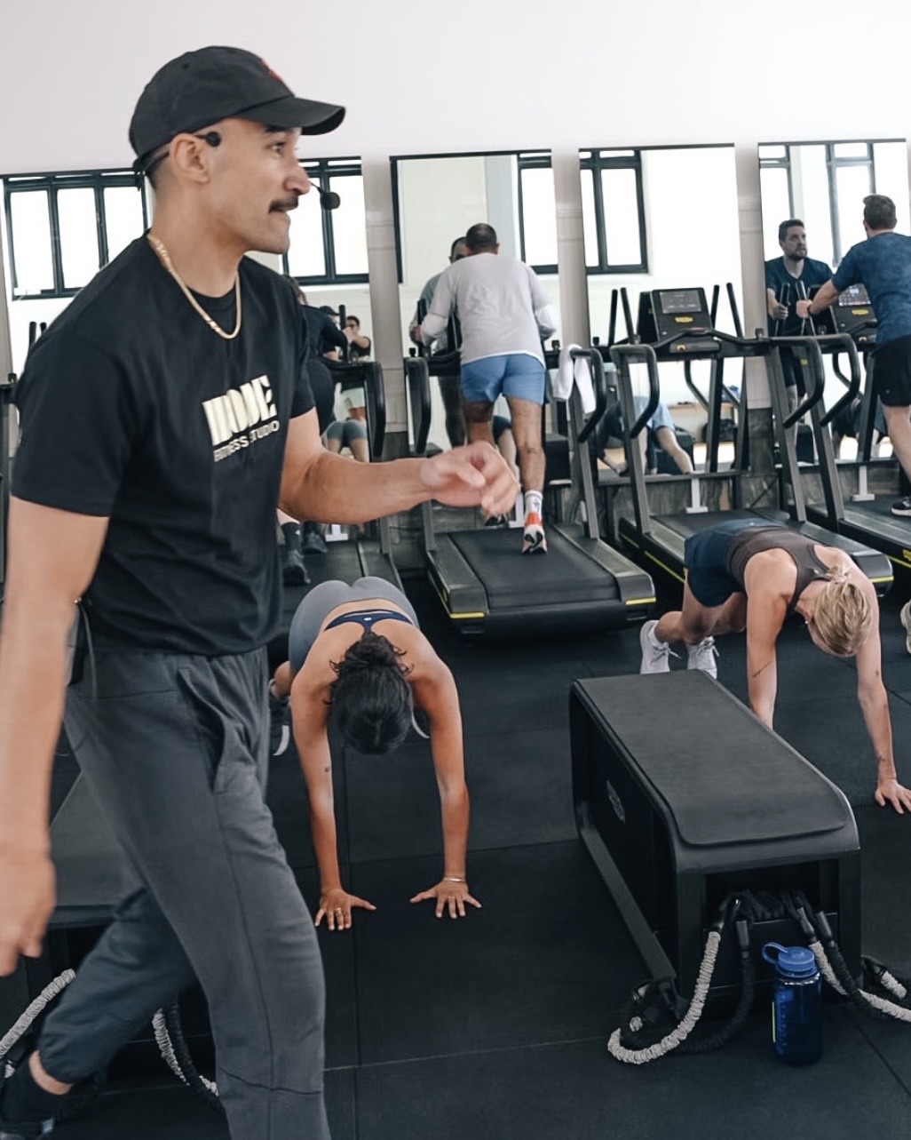 Coach leading treadmill session at MODE