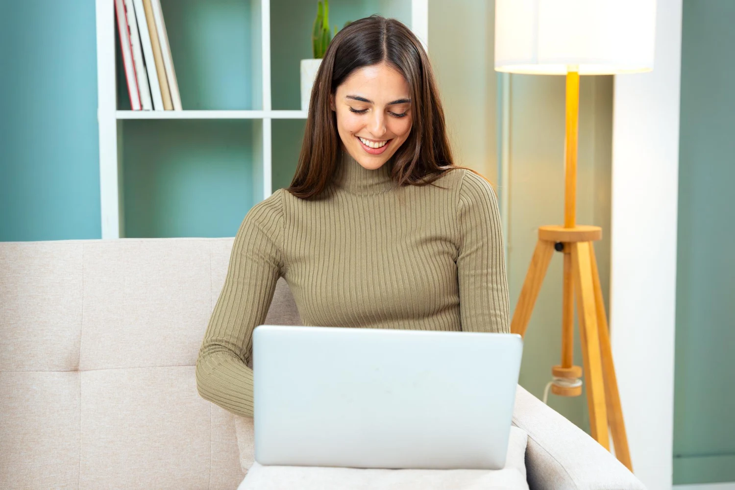 woman using laptop to prepare an Australian visa application at home