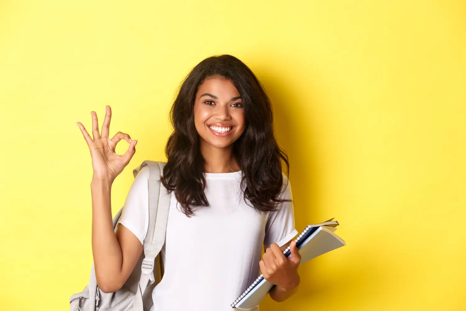 Smiling Student with Migroo Yellow Background