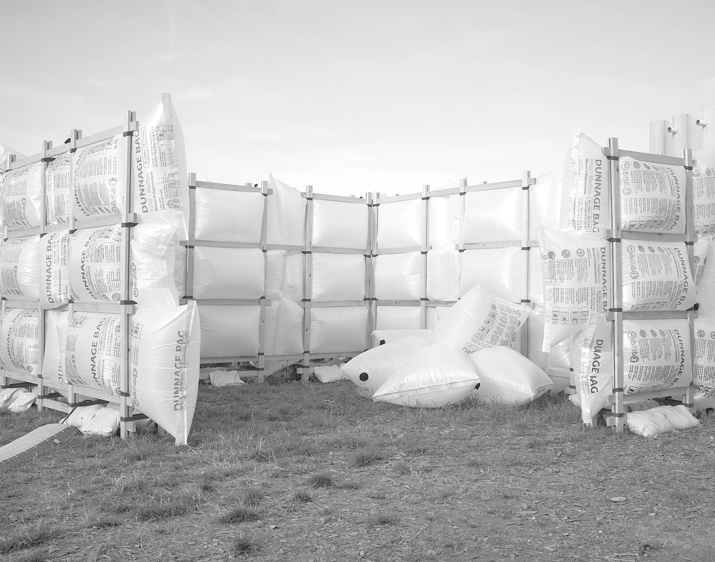 Air Pavilion by Joanne Jacobsen, Magnus Krautwald, Timothy Martin & Viggo Garfiel. The winner build of the 2024 edition is made of funnage bags filled with air and a light wooden structure held together with loop straps and sand bags.