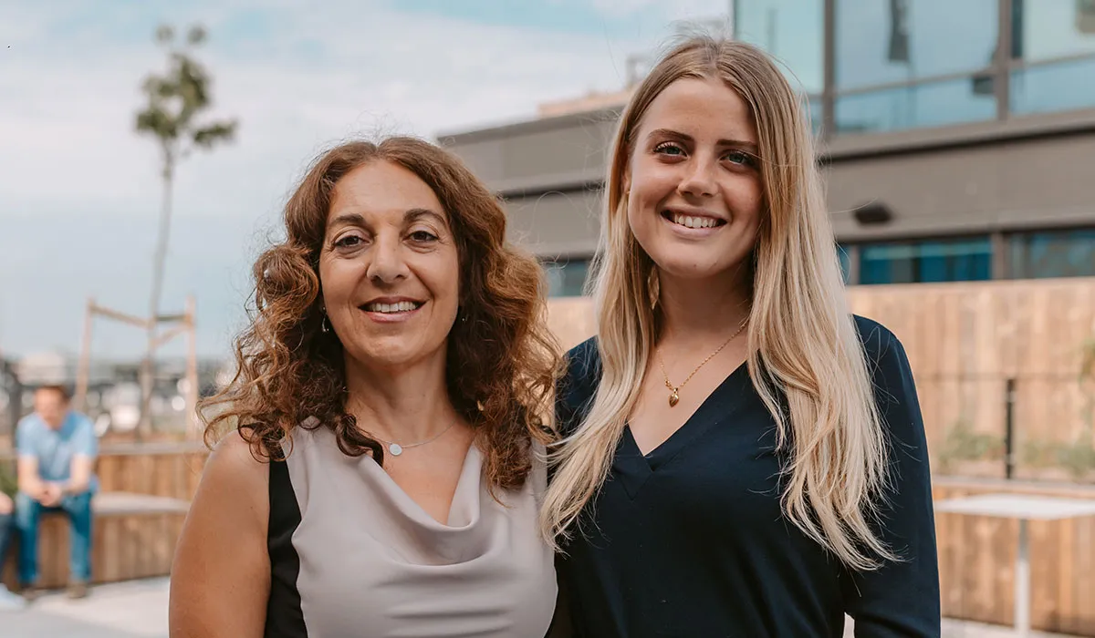 A couple of women standing next to each other.
