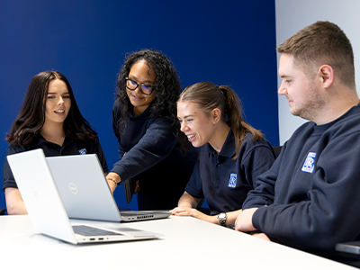 Colleagues working together at a computer