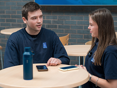 Colleagues chatting together in an informal meeting