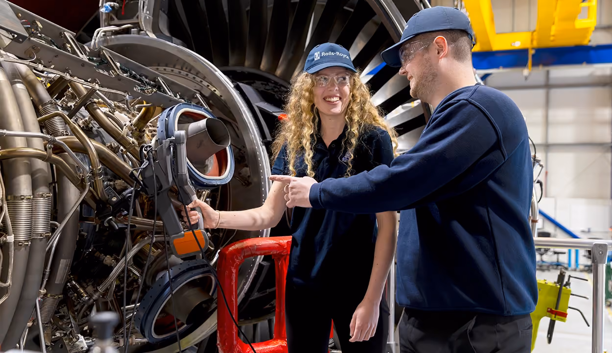 One co-worker explaining how to solve a problem to another