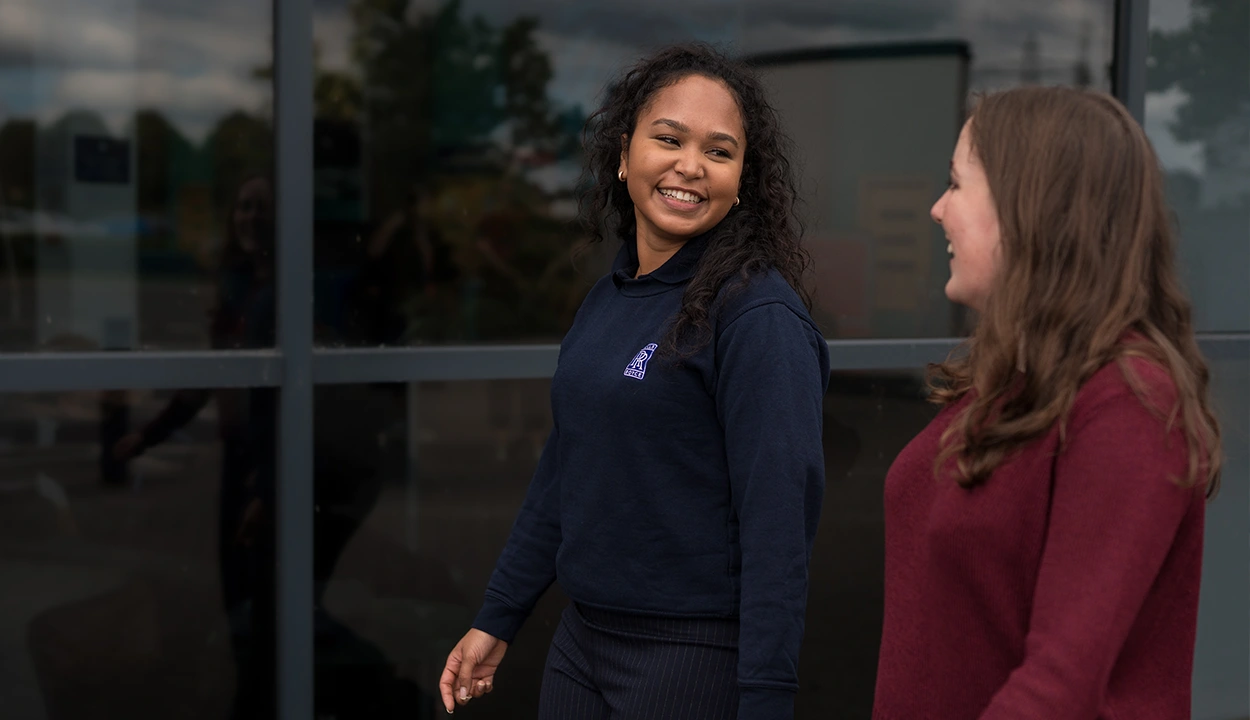 Colleagues chatting together in an informal meeting
