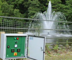 Aerating lake foutanin and lighting control panel installed at champneys mottram hall hotel, golf club and spa with delmar aerating fountain running in the background 