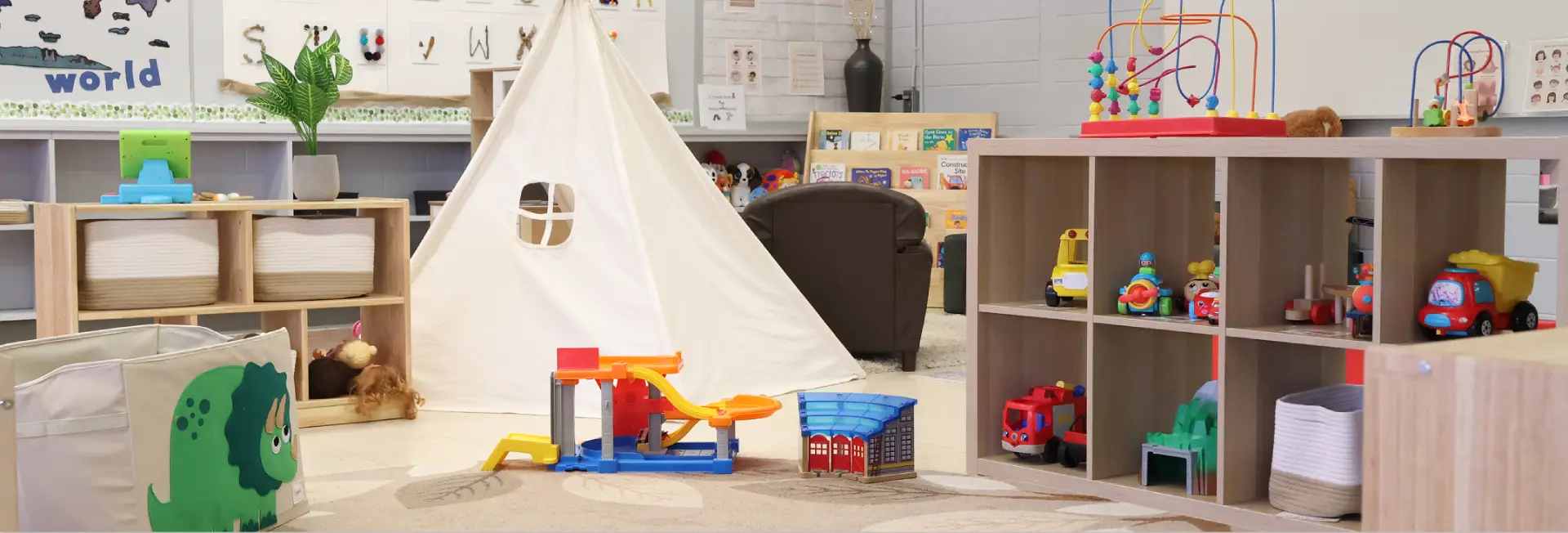 Room with a white play tent, toy shelves, and colorful toys scattered around.