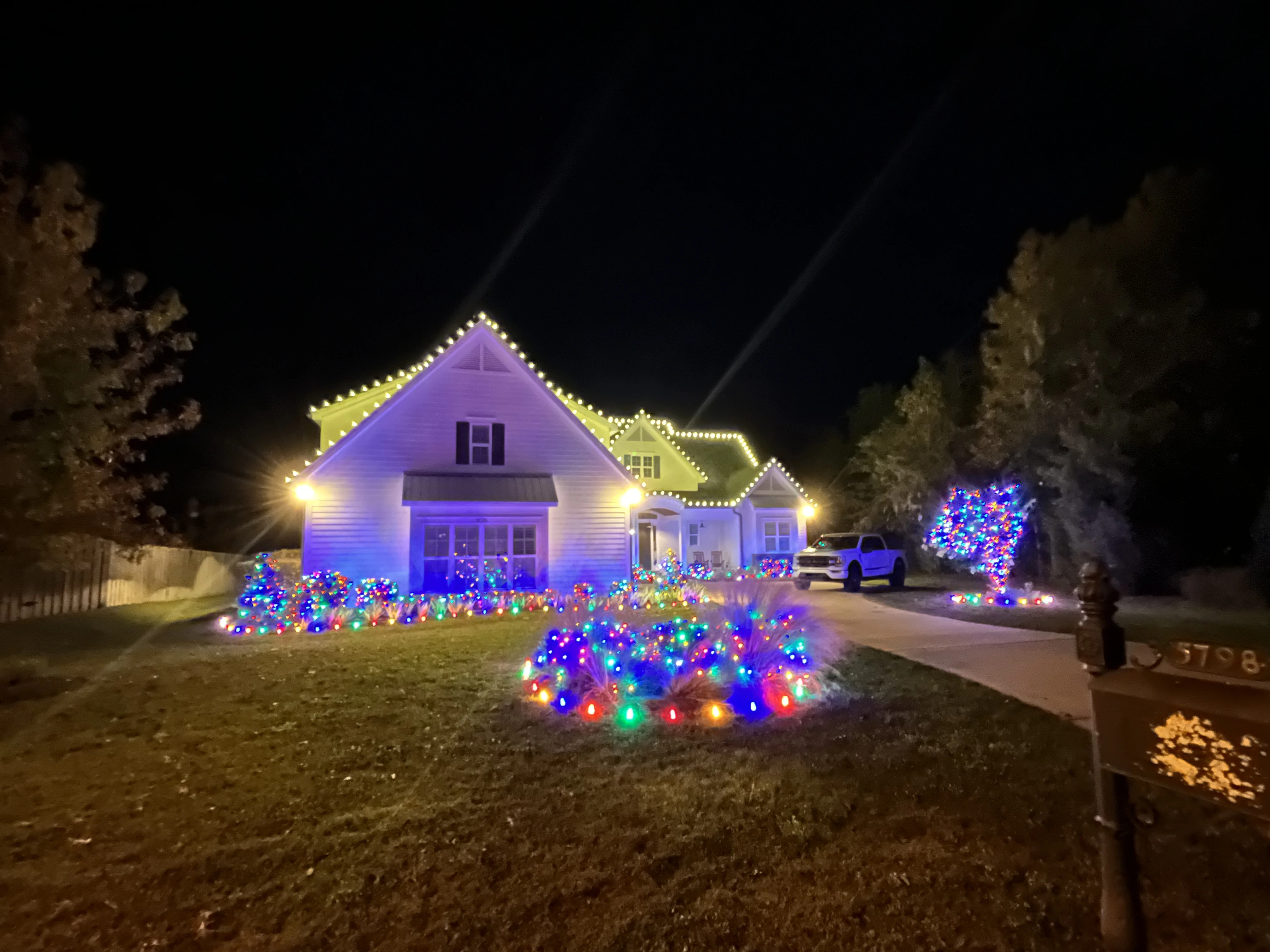 A house decorated with different colored lights.