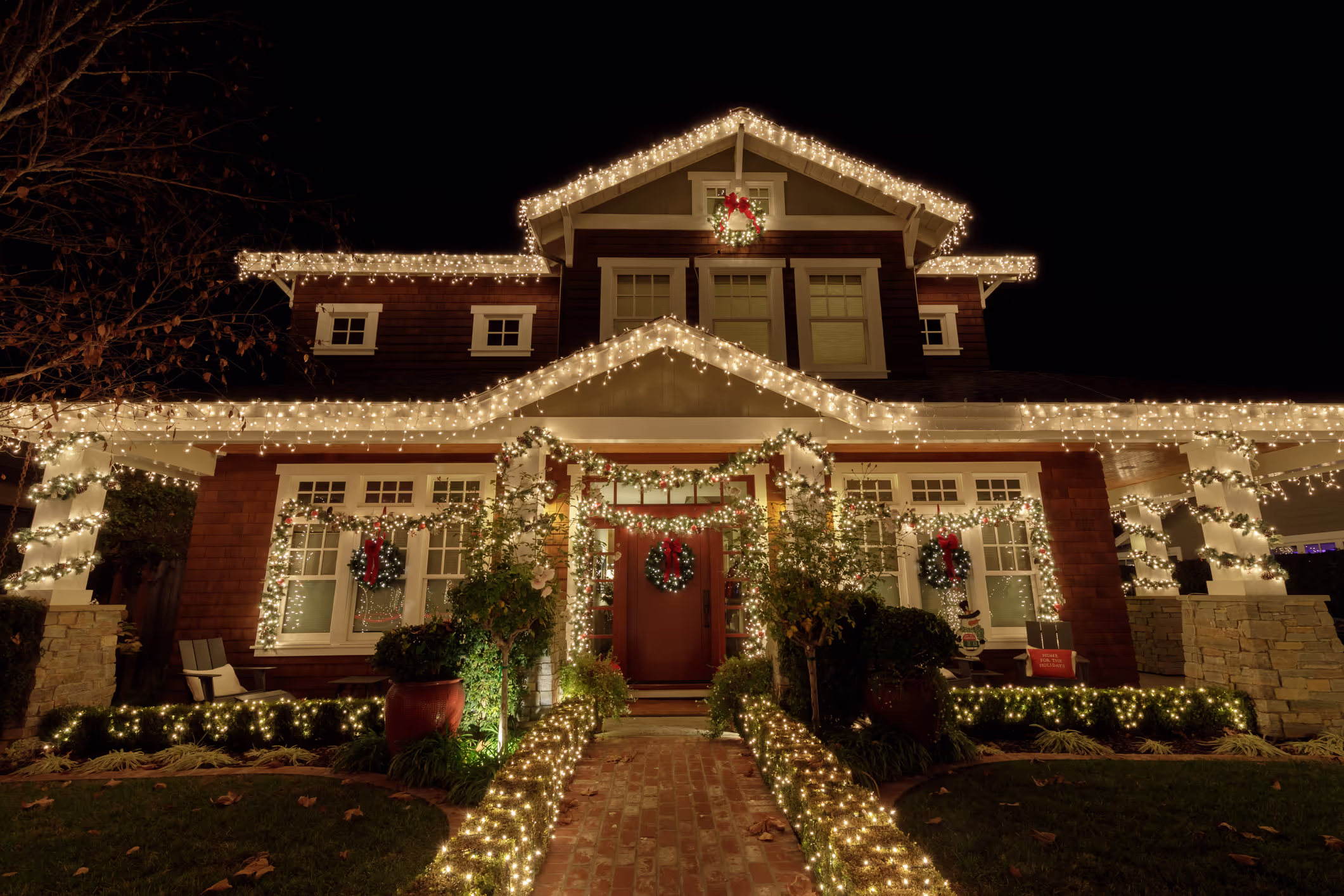 A mansion decorated with Christmas lights.