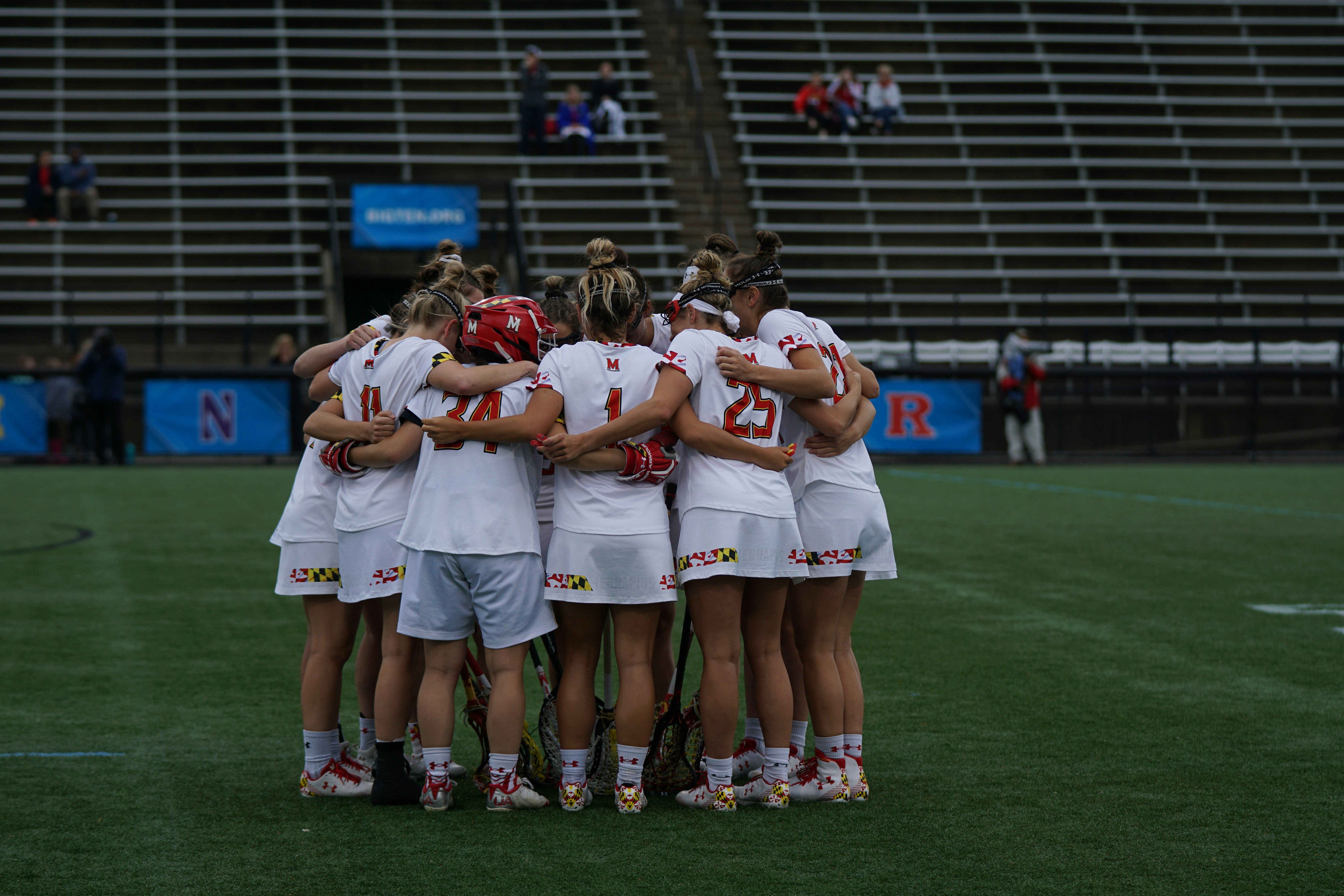 image of soccer players in a huddle