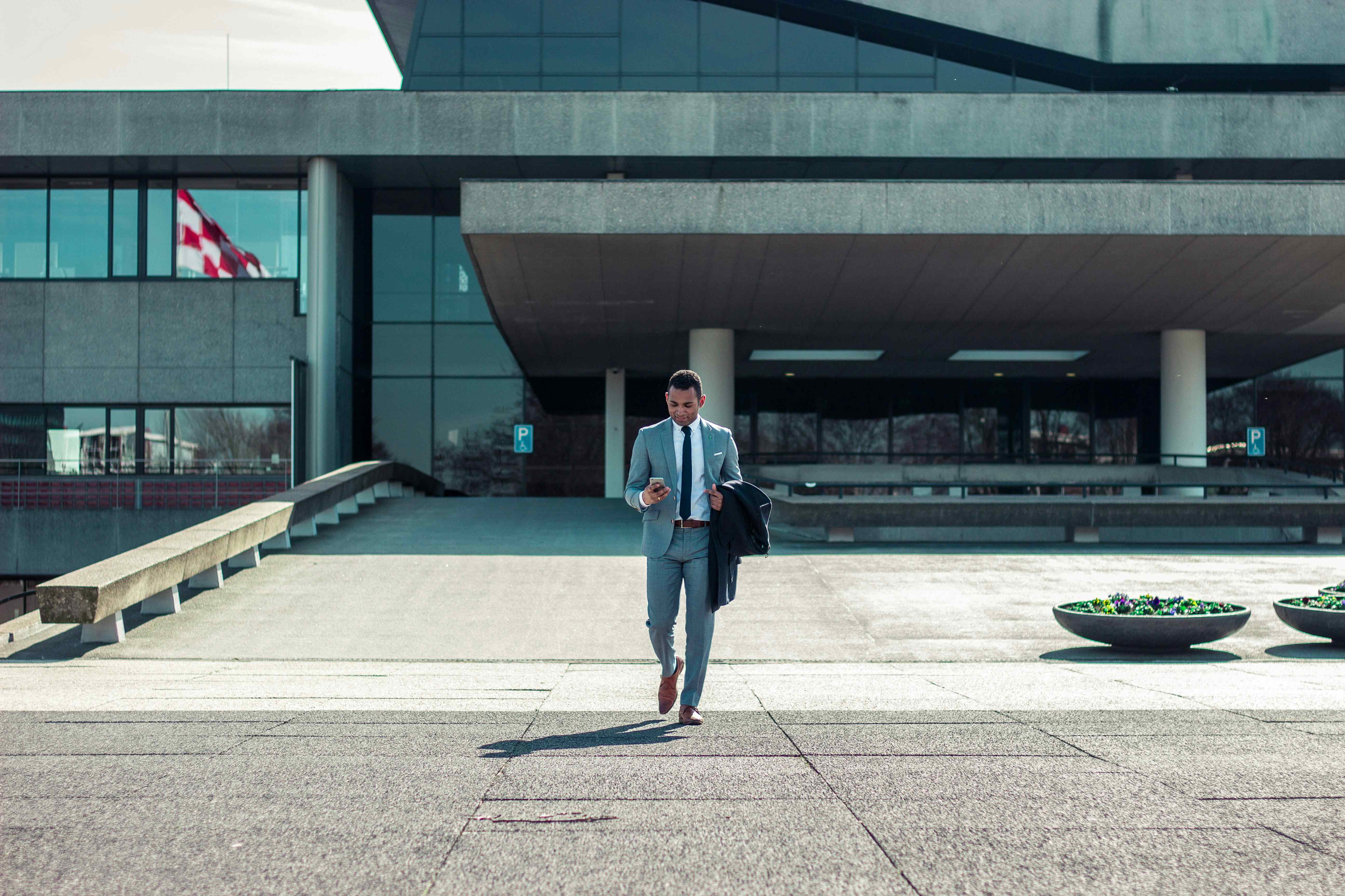 image of a man leaving an office building