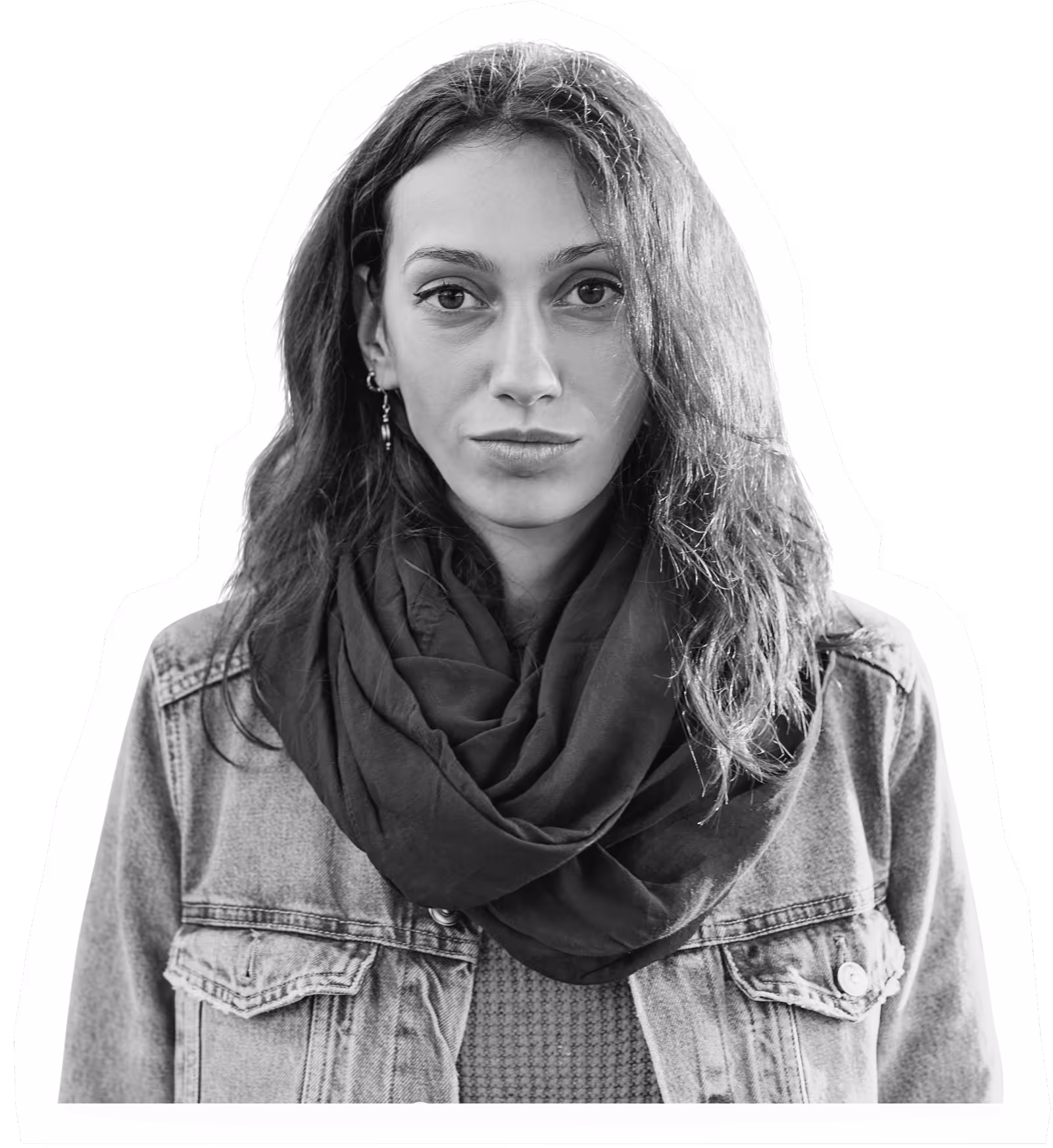 Person in denim jacket and infinity scarf looking directly at camera
