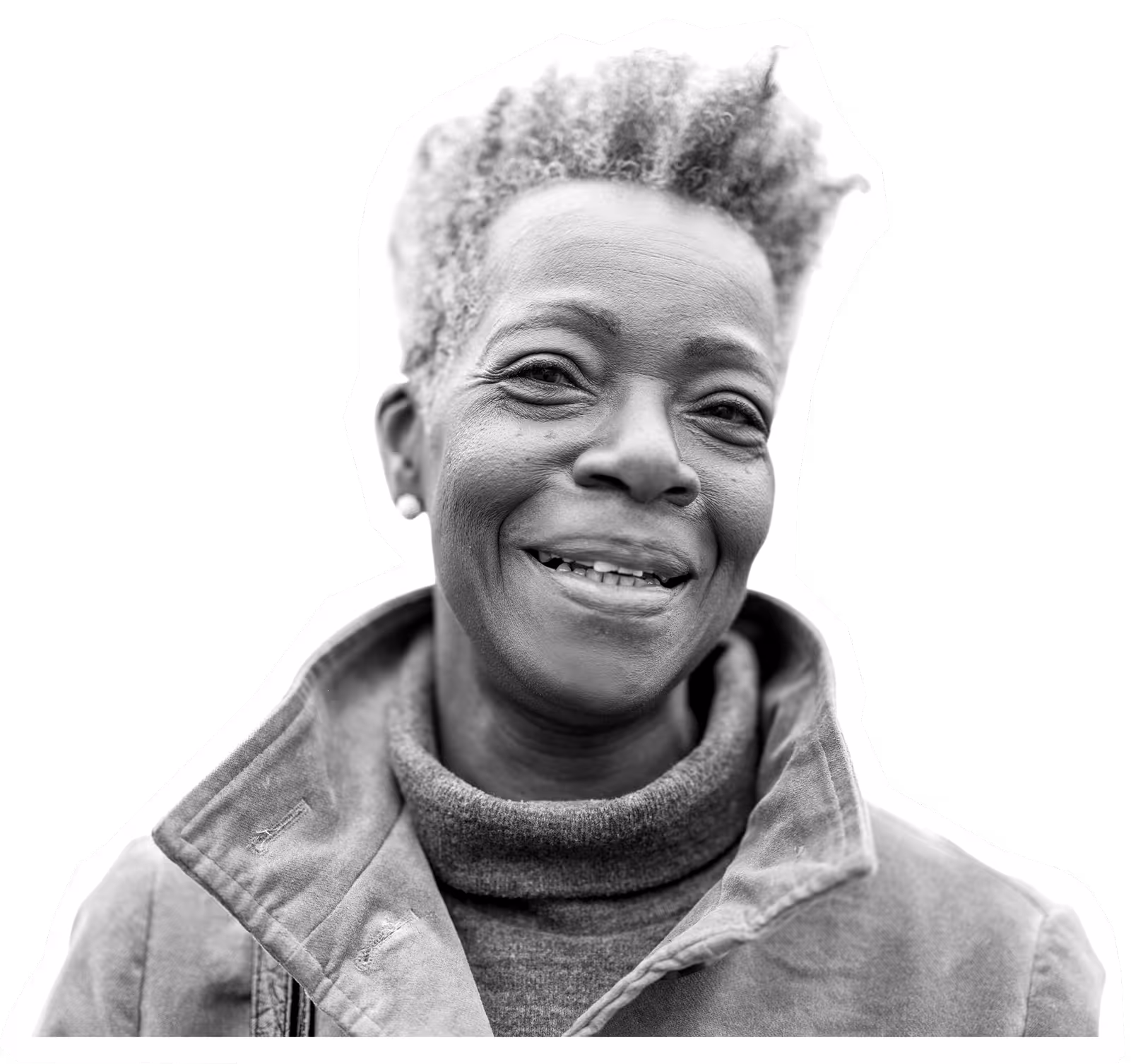 Smiling older person in winter coat, black and white portrait