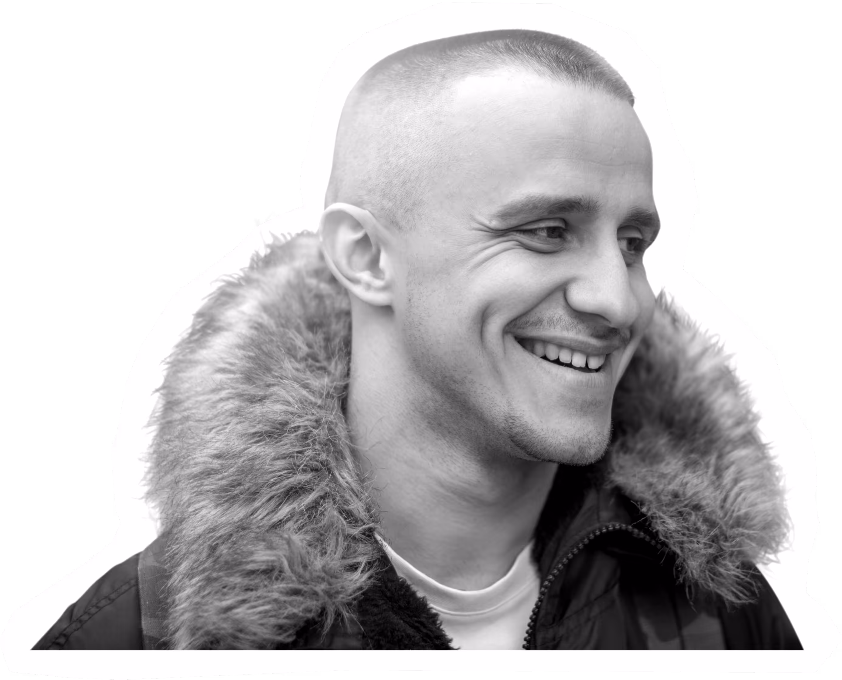 Smiling person in fur-lined jacket, black and white portrait