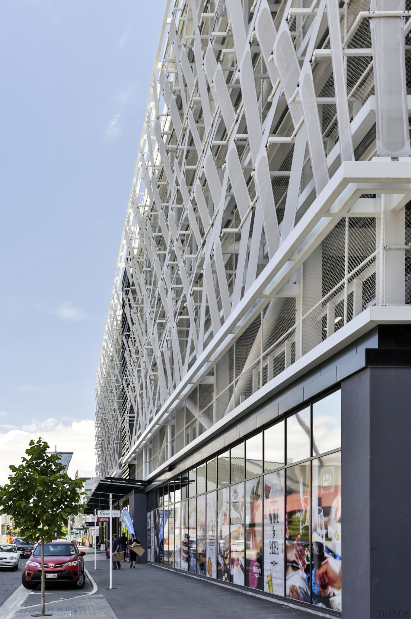 White facade panels that have been arranged in a 3 Dimensional zig zag pattern, allowing better airflow into the space.