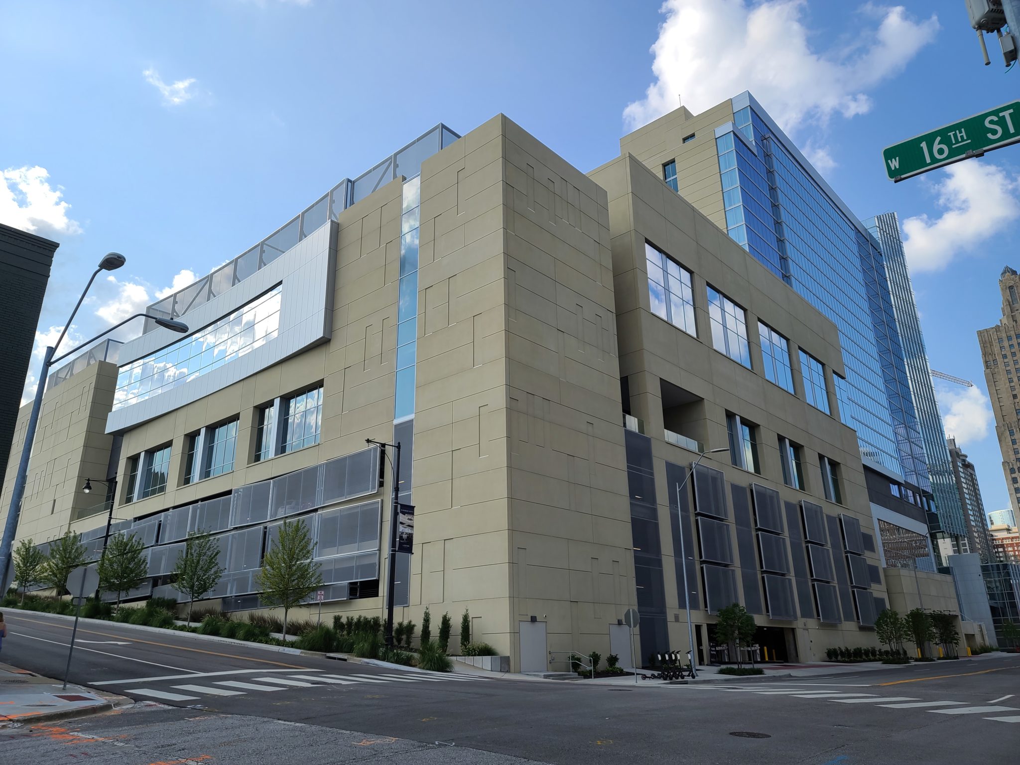 A view of the entire hotel that shows the metal parking structure that swoops out to allow for ventilation.
