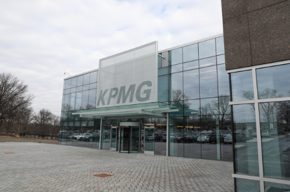 A white branded facade sat on top of the entrance of a building.