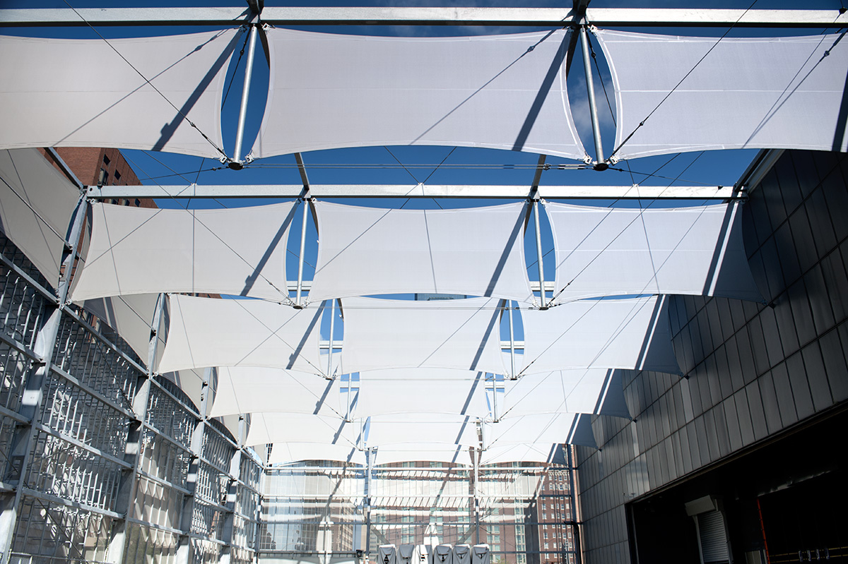 White FlexFacade stretch panels that are aligned three in a row with six visible rows parallel to each other.