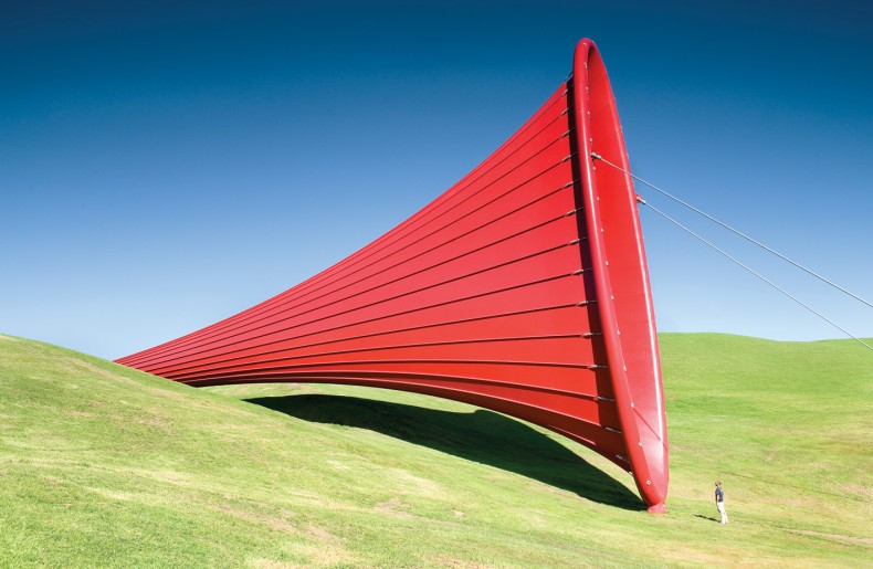 A red cone shaped sculpture designed by Anish Kapoor made out of a PES waterproof membrane.